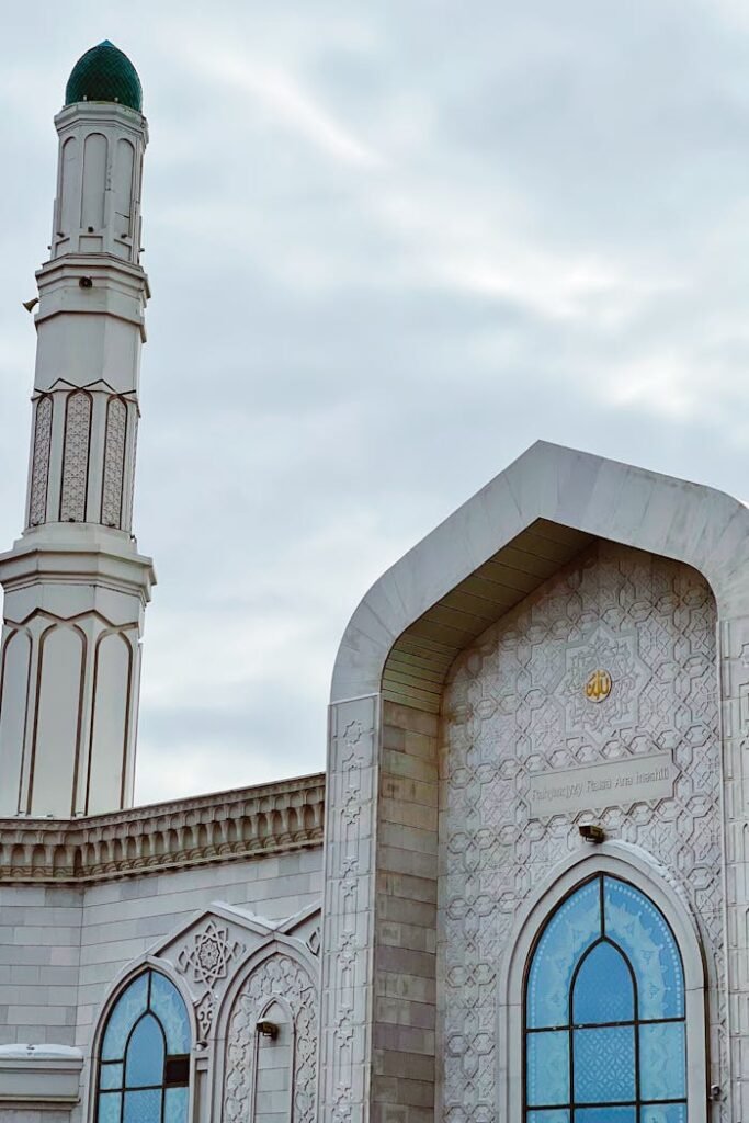 Intricate mosque facade and minaret detail in Astana, Kazakhstan during daytime.